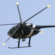 Illustration for article titled Watch This Night Stalker MH-6 Little Bird Land On A Tiny Concrete Barrier
